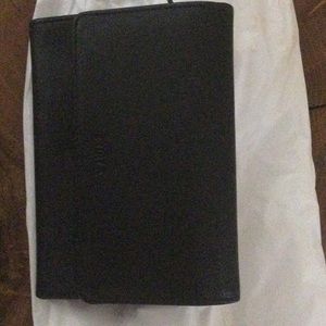 A midium size black wallet. Furla.  Made in Italy
